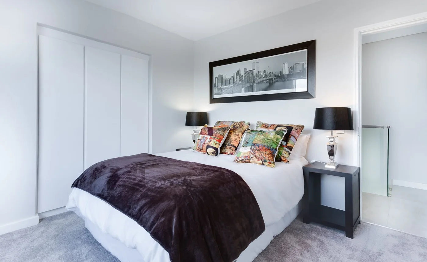 A restful bedroom with neutral furniture