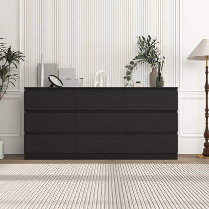 Black handleless nine-drawer dresser against a dark green wall