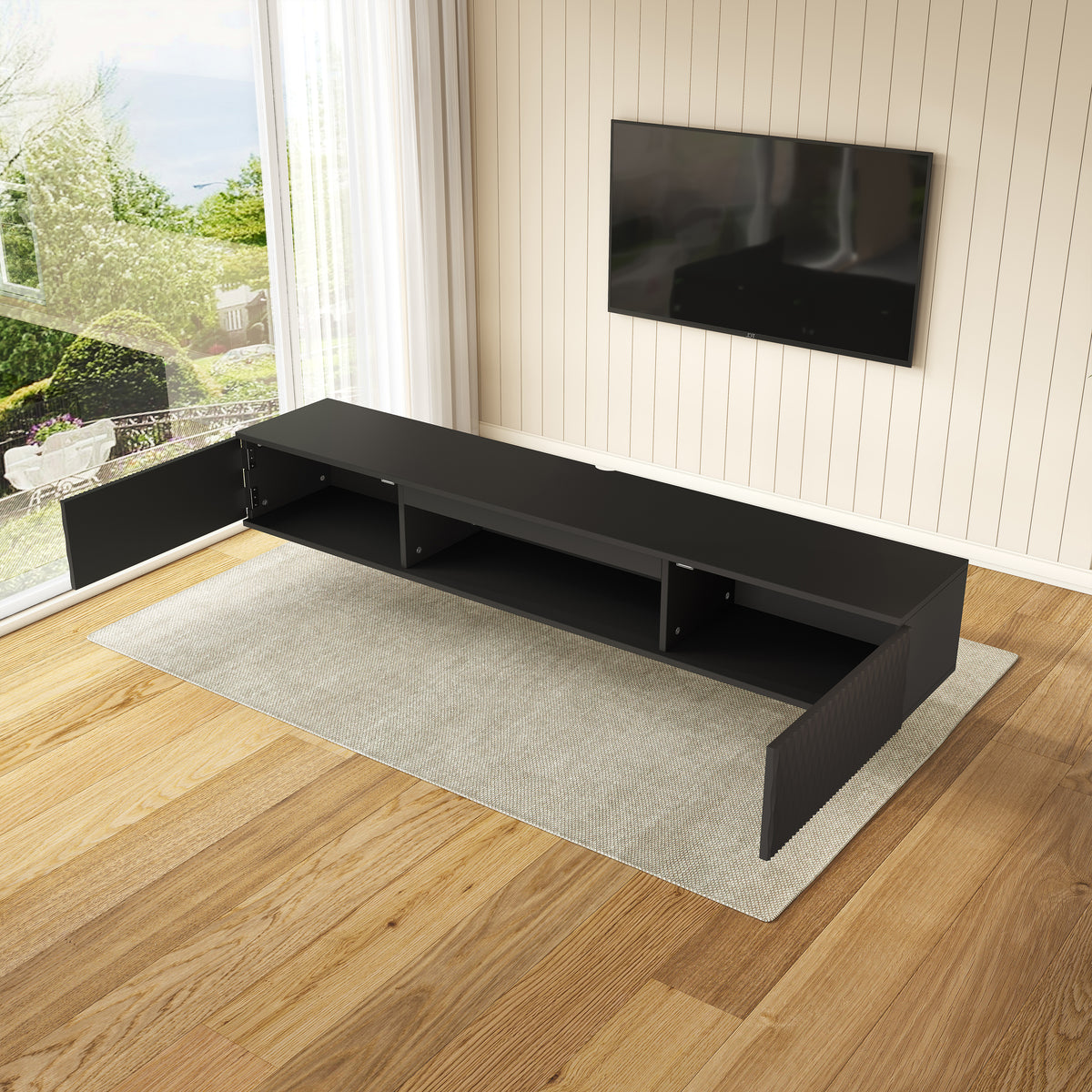 Overhead view of black media console with cabinet doors open