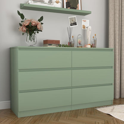 Front view of green six-drawer dresser in a furnished room