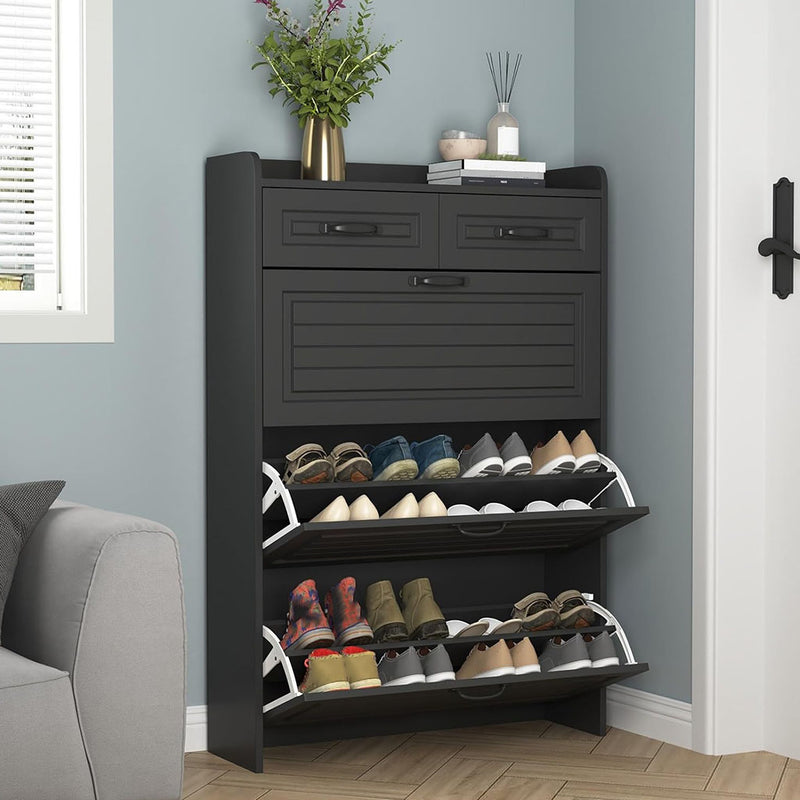 Black shoe cabinet with flip drawers open in an entryway