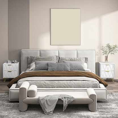 Two white chevron nightstands placed beside a bed