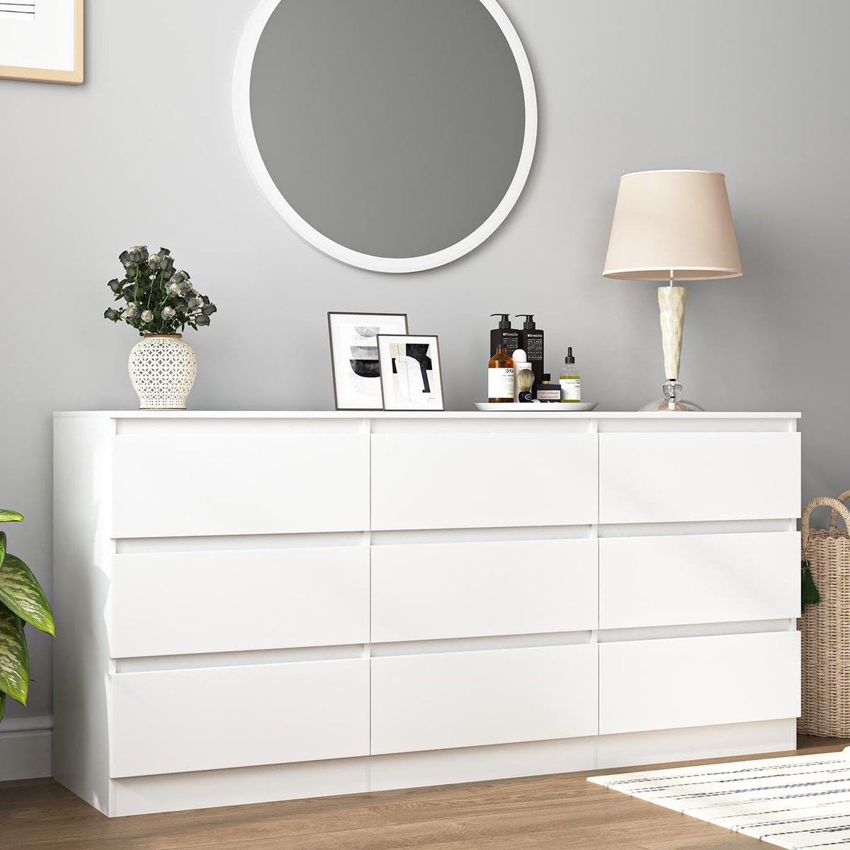 White nine-drawer dresser in a bedroom beneath a round mirror